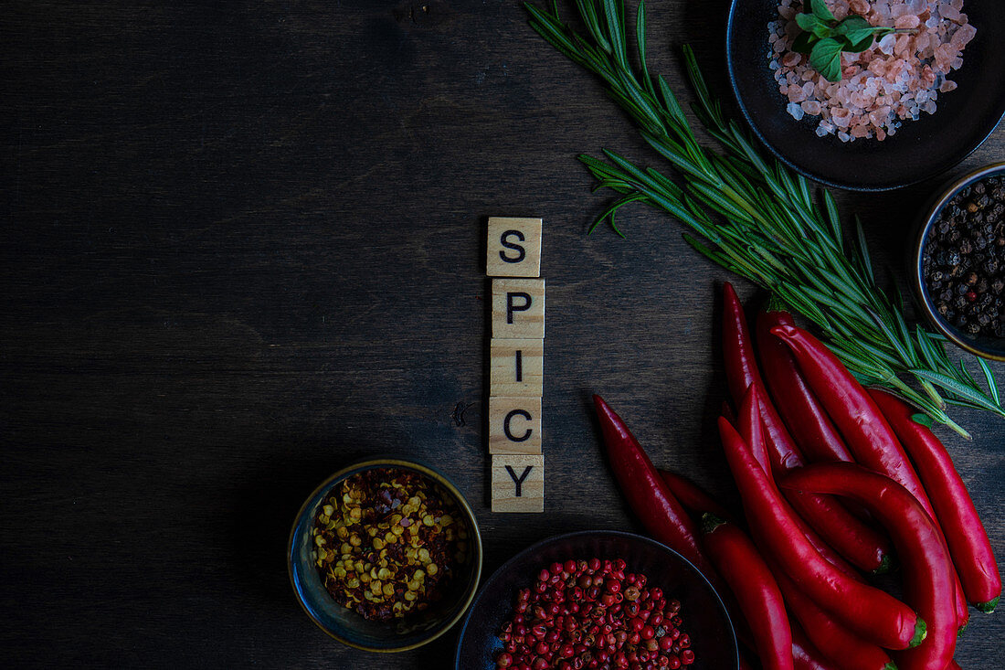 Cooking concept with spice ingredients on wooden table with copy space