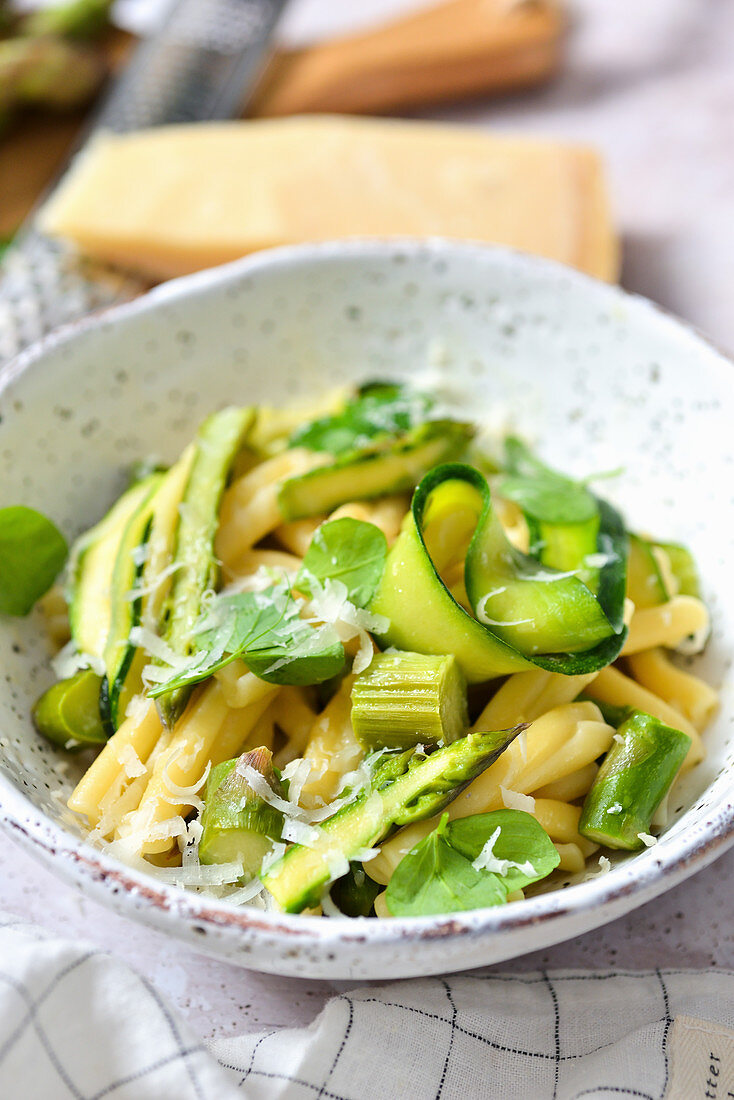 Pasta with zucchini asparagus and Parmesan cheese