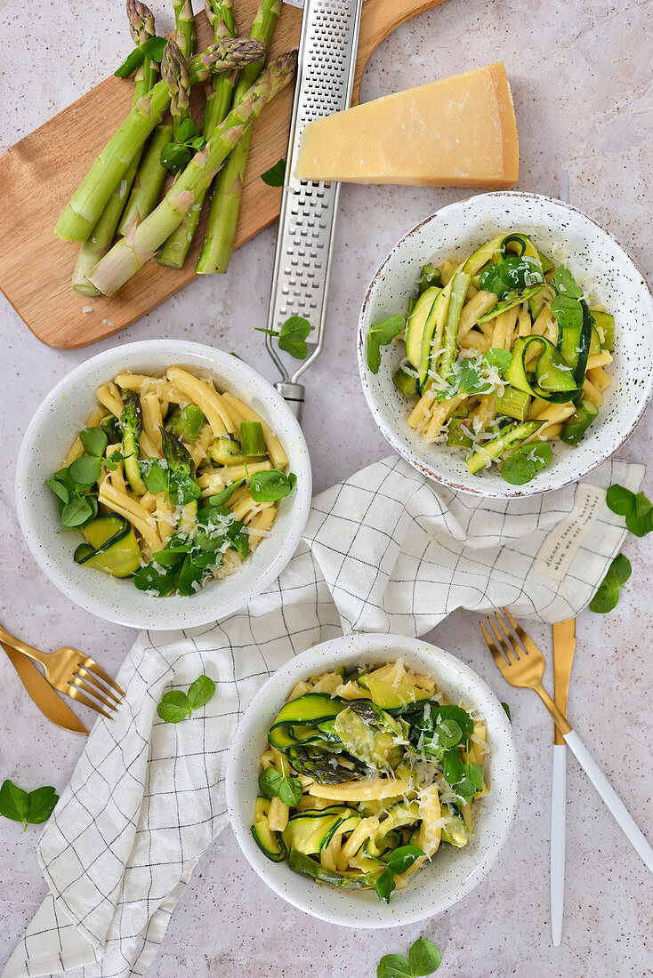 A healthy dinner pasta with green asparagus and zucchini