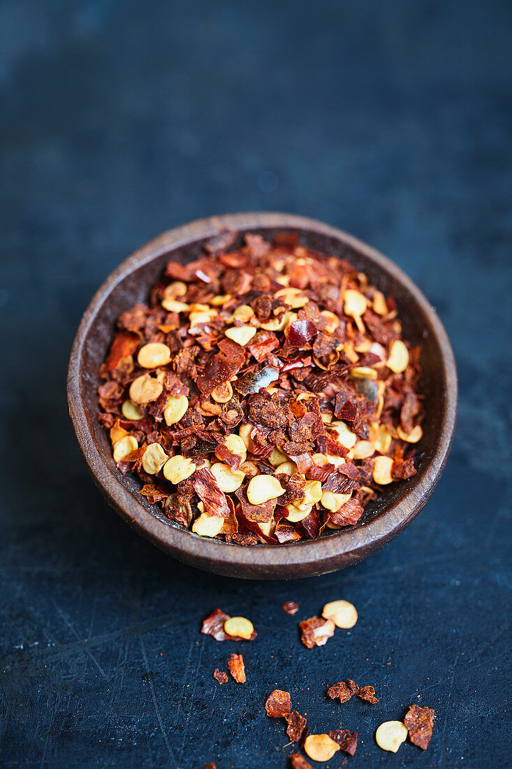Chilli flakes in a wooden bowl