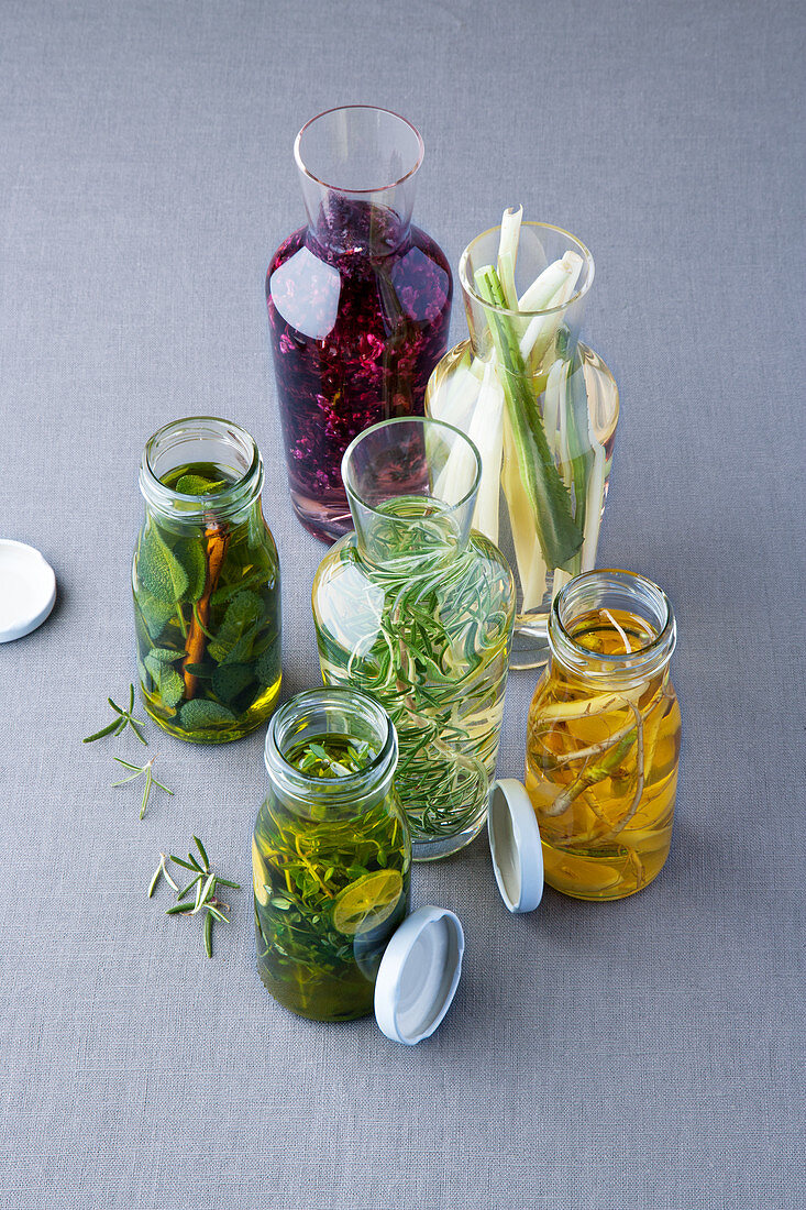 Herb oils and vinegars with thyme, rosemary, basil, sage and coriander