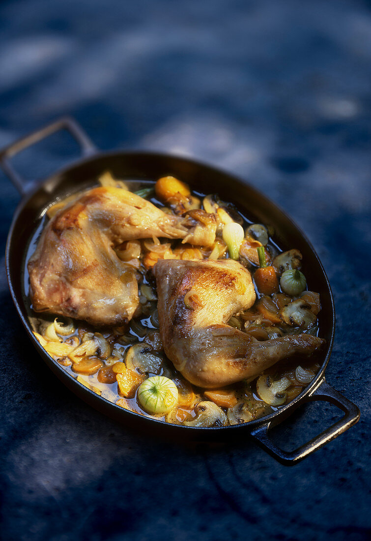 Chicken legs with vegetables and mushrooms