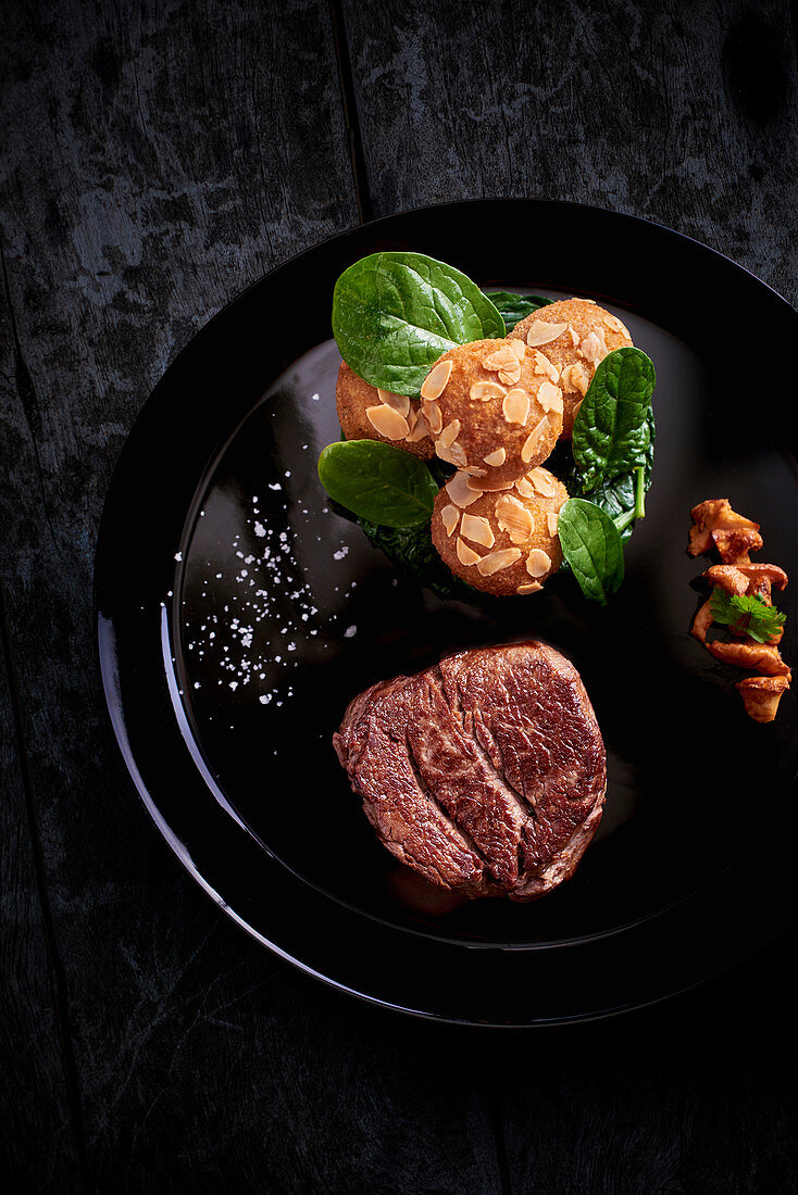 Beef fillet with potato croquettes and spinach