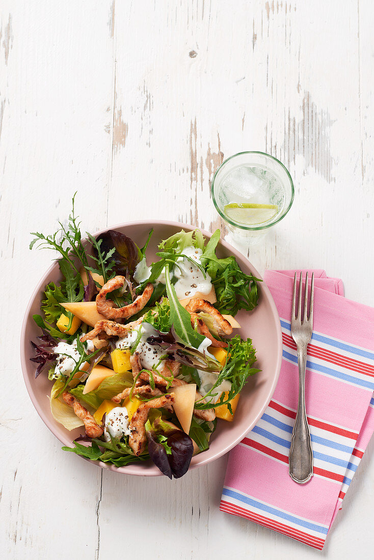 Summer salad with melon and chicken
