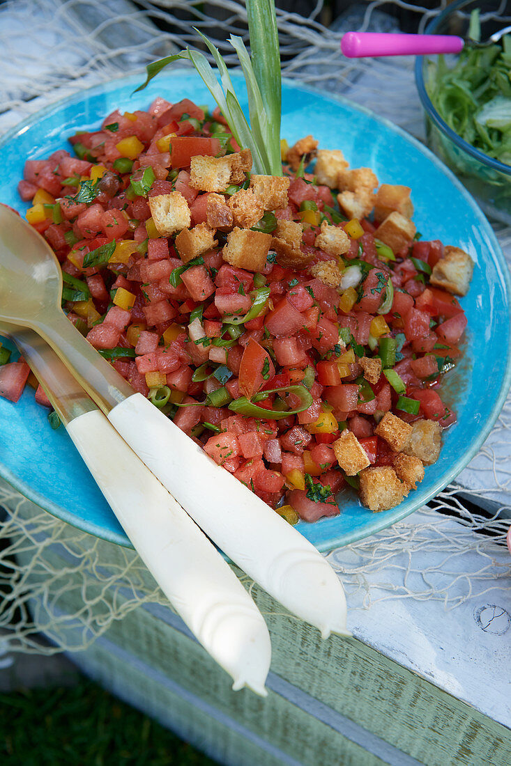 Colourful summer salad with tomatoes, peppers and croutons