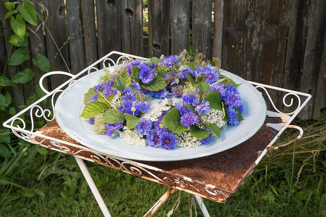 Wreath of cornflowers, cow parsley and hornbeam leaves