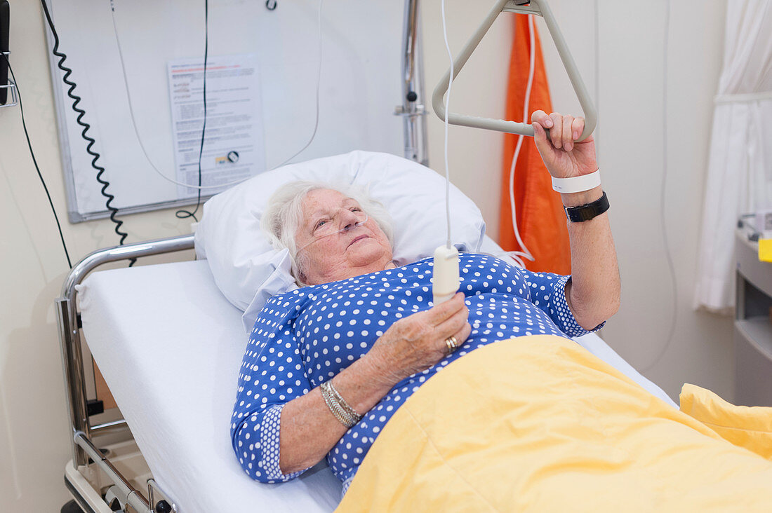 Hospital patient with hoist and alarm button