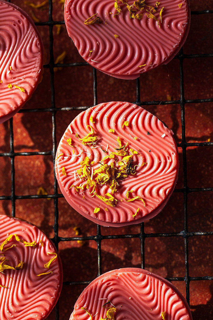 Pink cookies with edible flowers