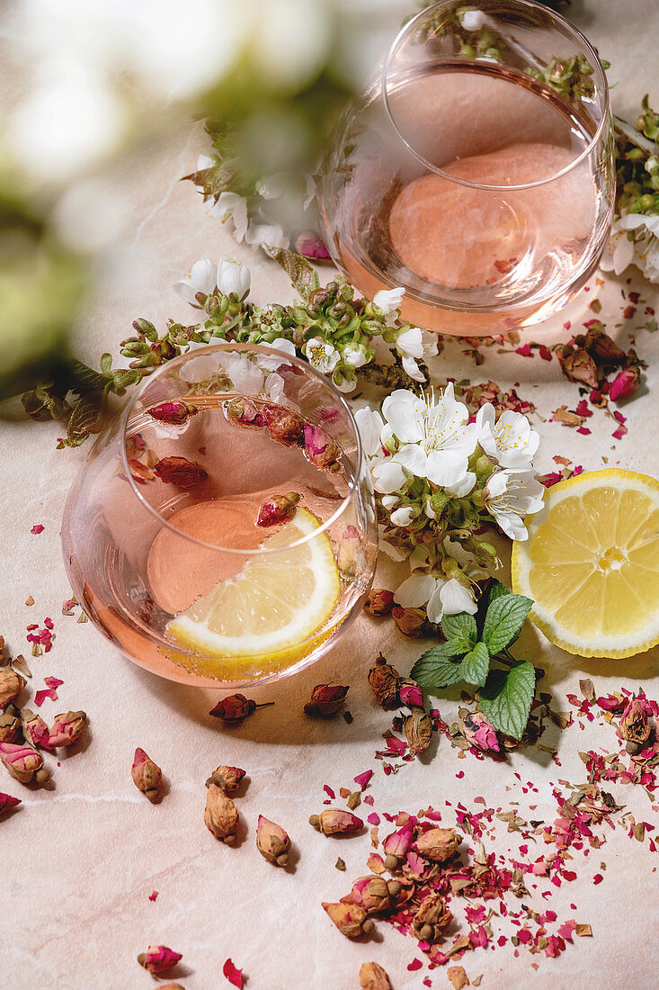 Pink champagne cocktails with dried rose petals