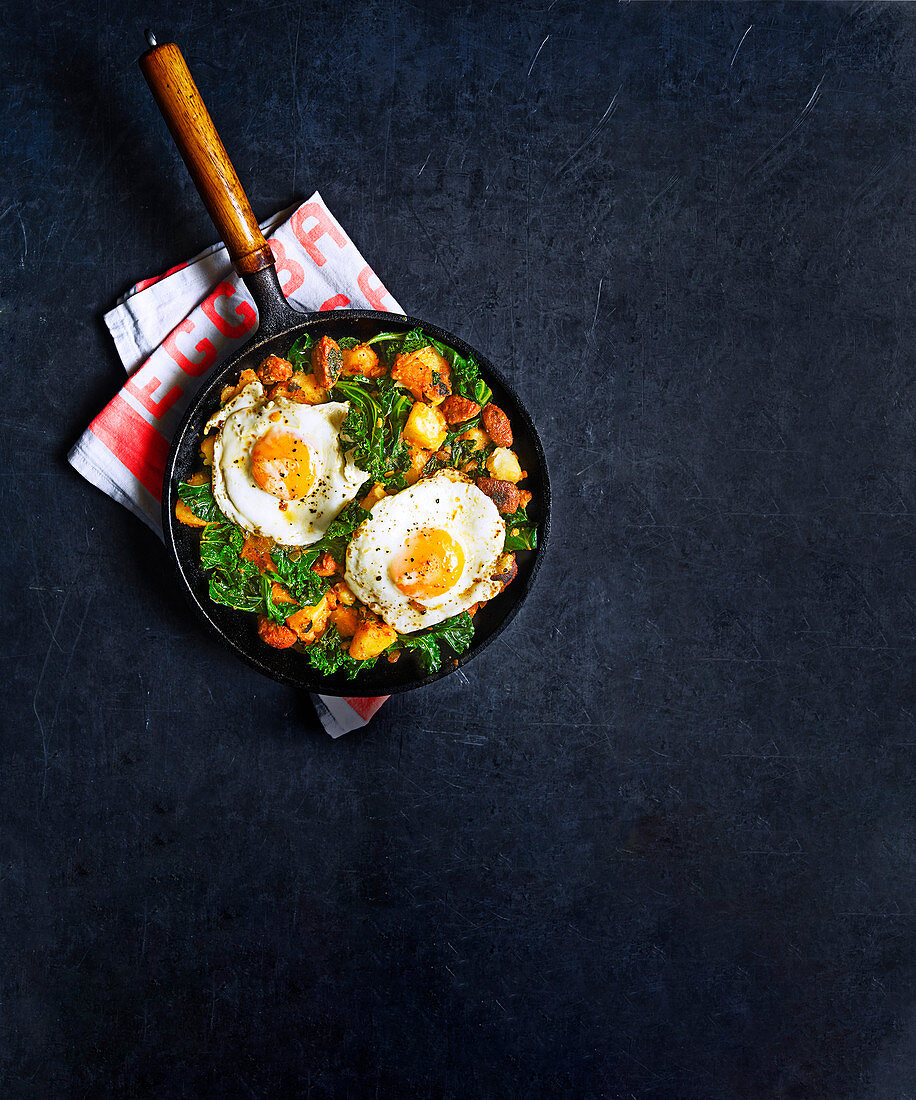 Chorizo and kale hash with fried eggs