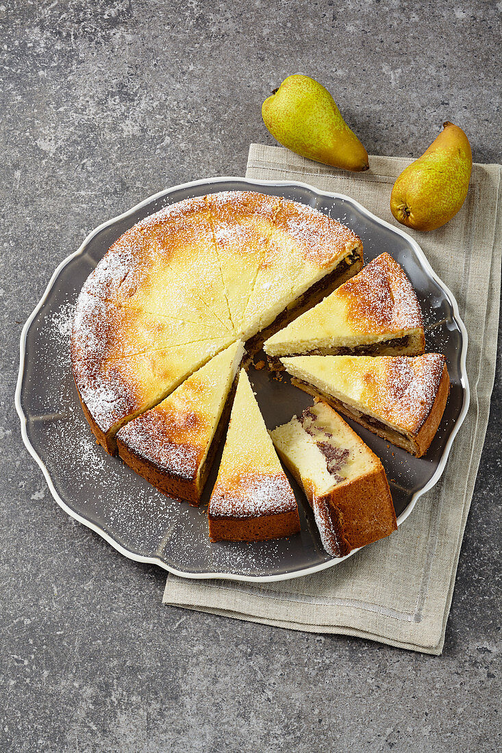 Pear and poppyseed cheesecake, sliced