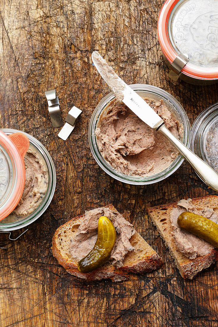 Homemade pâté in jars and on bread