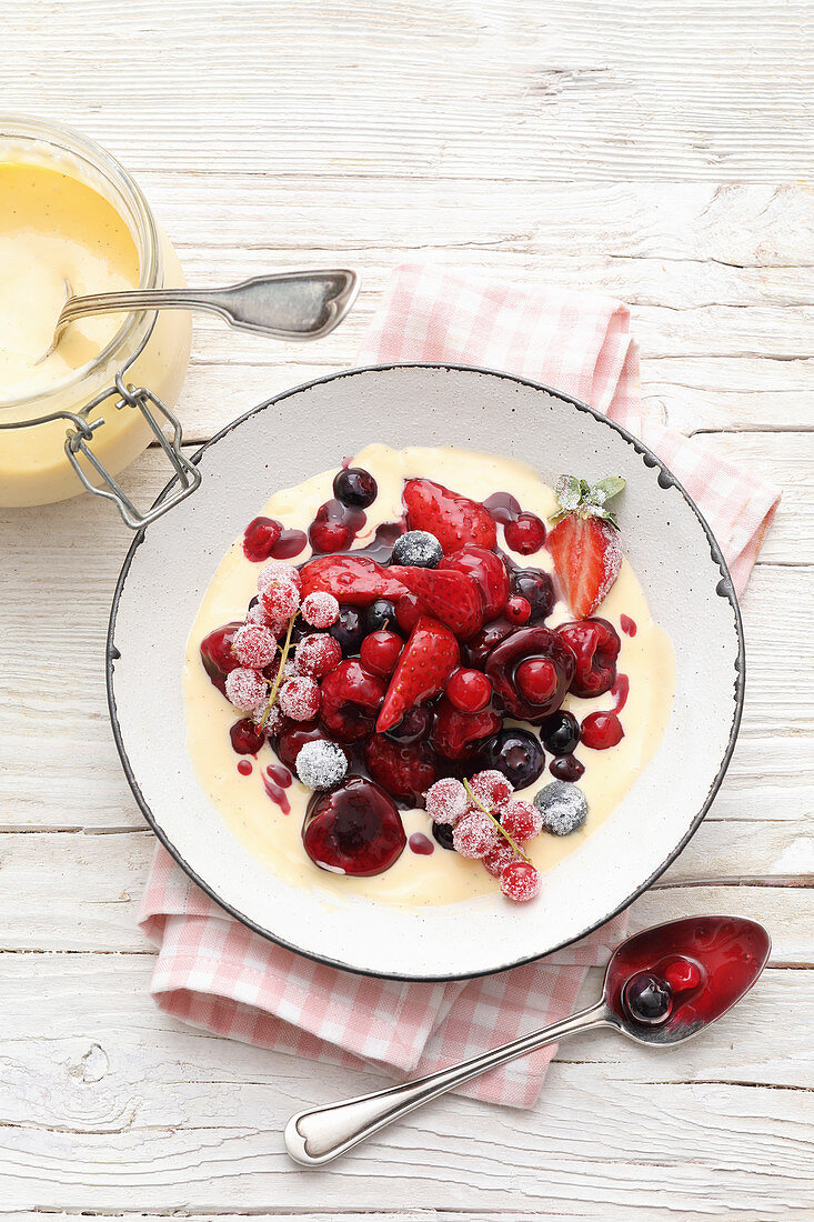 Red berry compote with custard