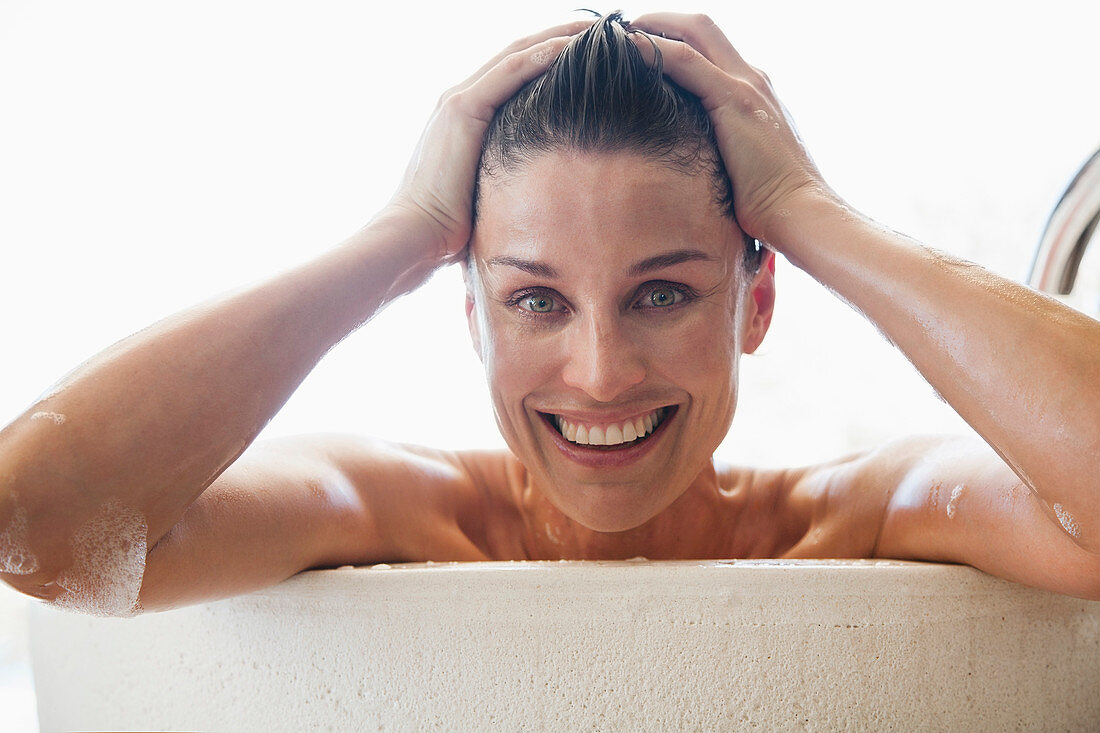 Portrait happy woman enjoying bath