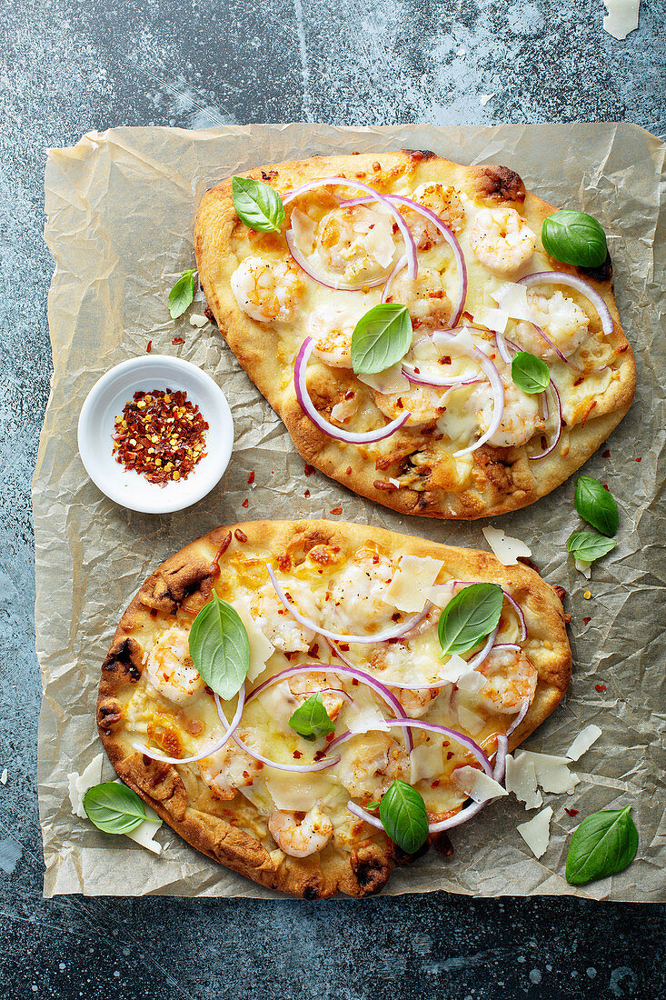 Shrimp parmesan spicy flatbread with chili flakes