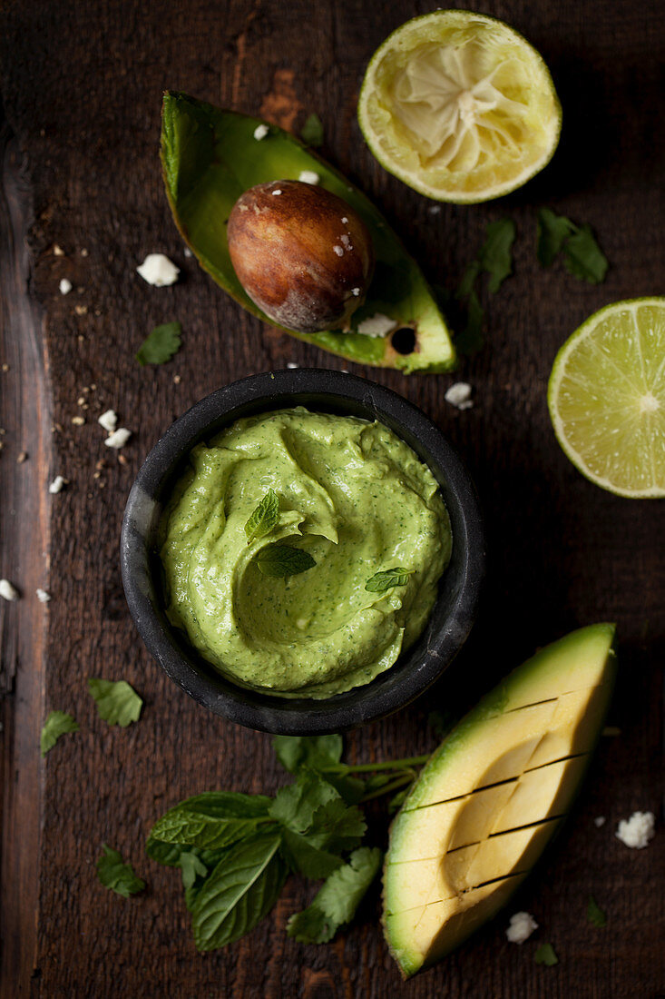 Avocado and whipped feta dip with chopped avocado and lime half