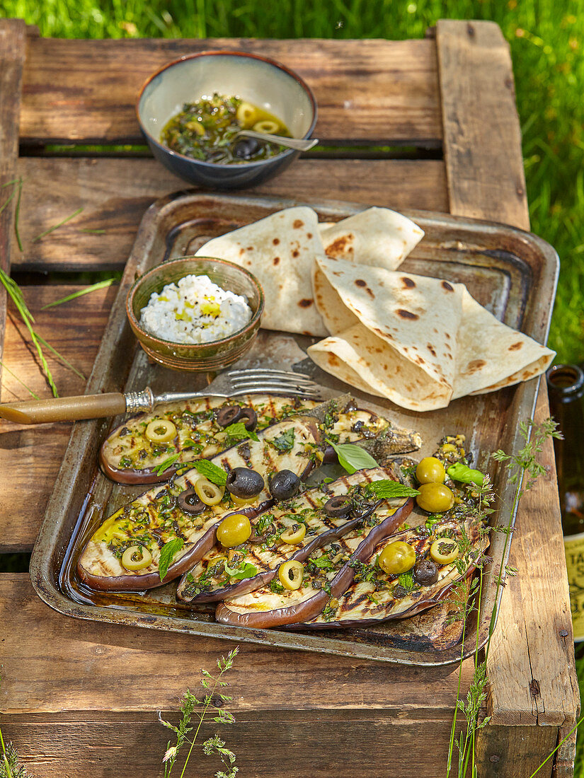 Marinated eggplant with olives and homemade tortillas