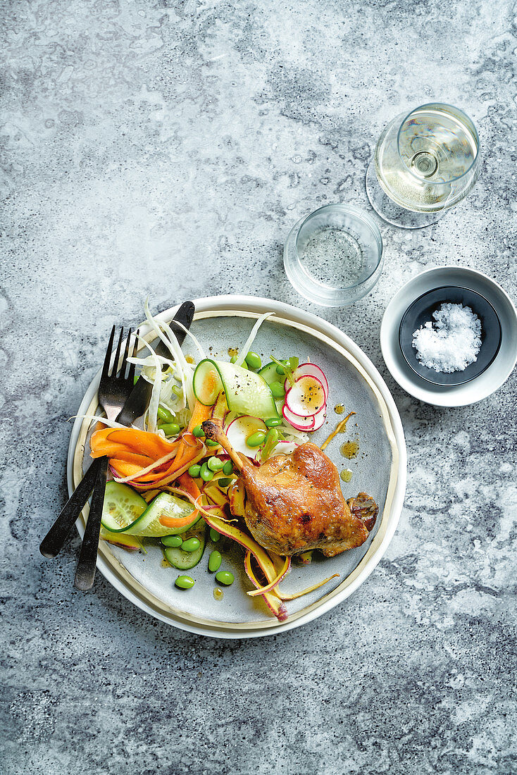 Duck confit with cucumber radish and orange slaw