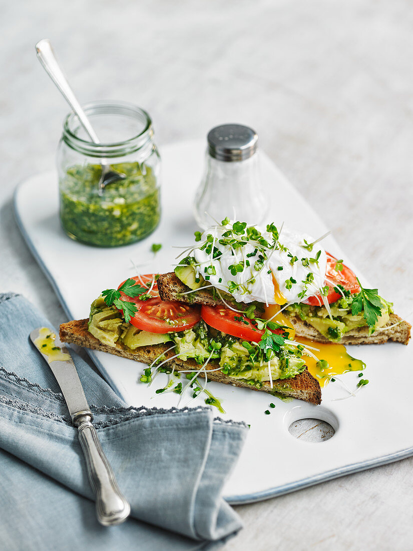 Toast with avocado, tomato and a poached egg