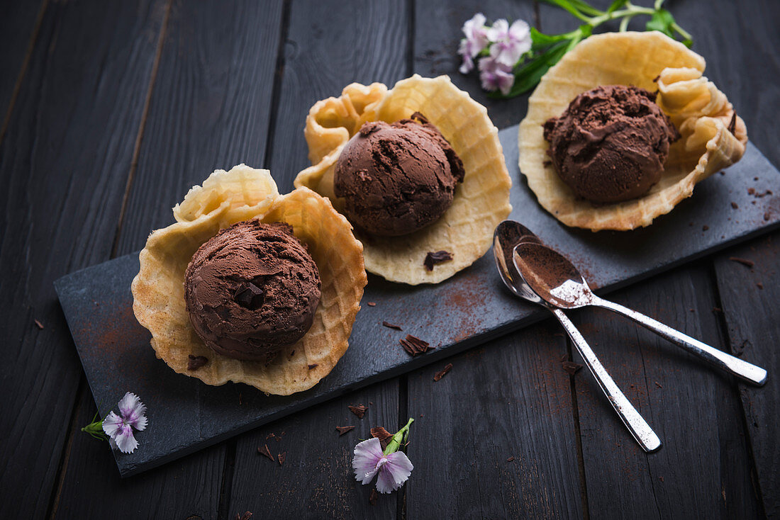 Vegan chocolate ice cream with chocolate chips in waffle shells