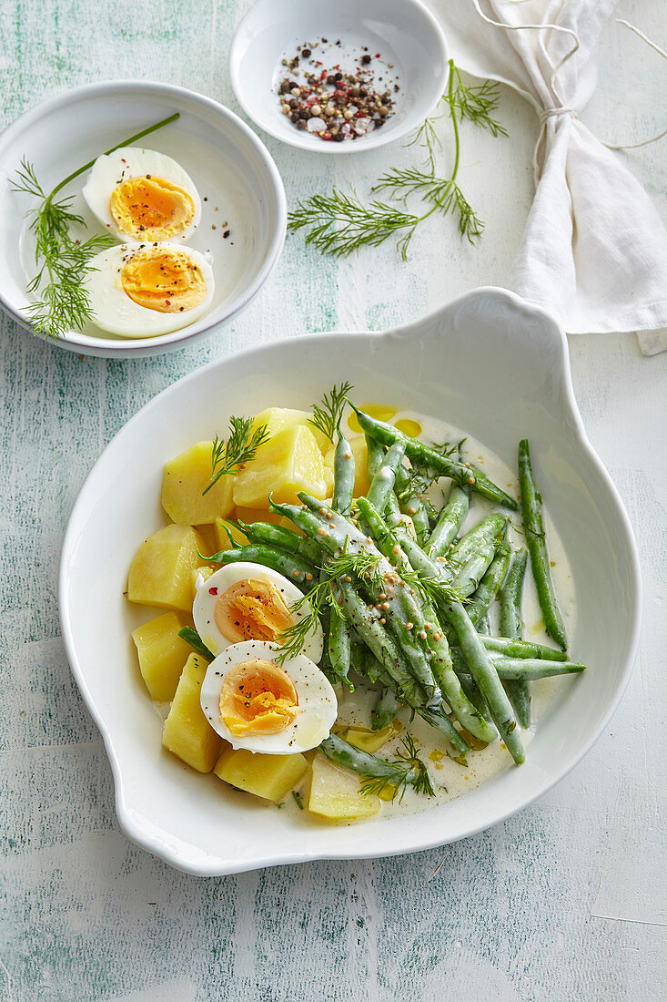 Green beans in mustard sauce with potatoes and egg