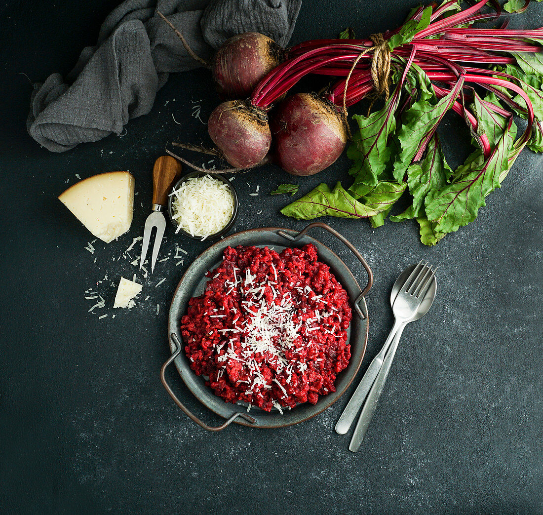 Beetroot risotto with hard cheese, caramelized leaves