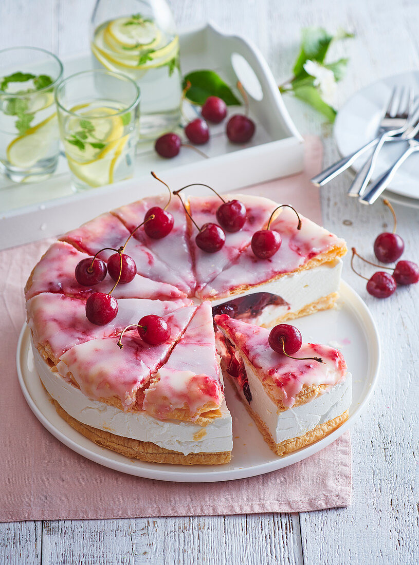 Cake with cherries and icing sugar