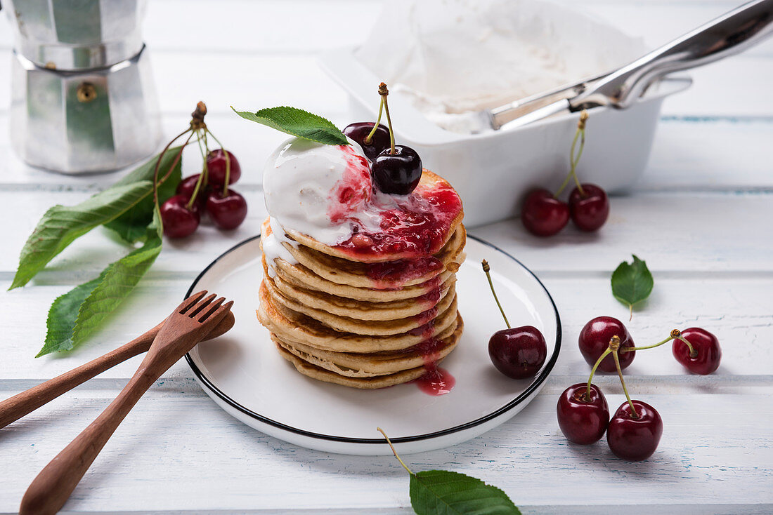 Pancakes with vanilla ice cream, cherry jam and cherries