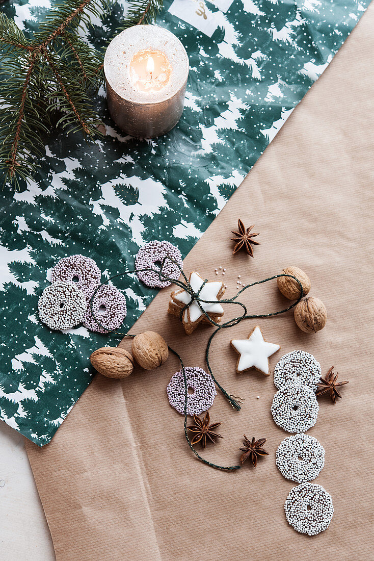 Cinnamon star and sugar ring biscuits, star anise, walnuts and candle