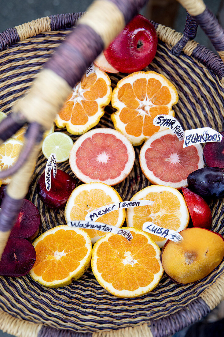 Citrus fruit with name tags in a basket