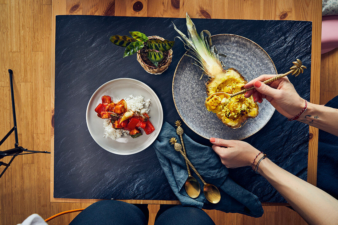 Sweet-and-sour tofu and stuffed pineapple with coconut and turmeric rice and curry tempeh