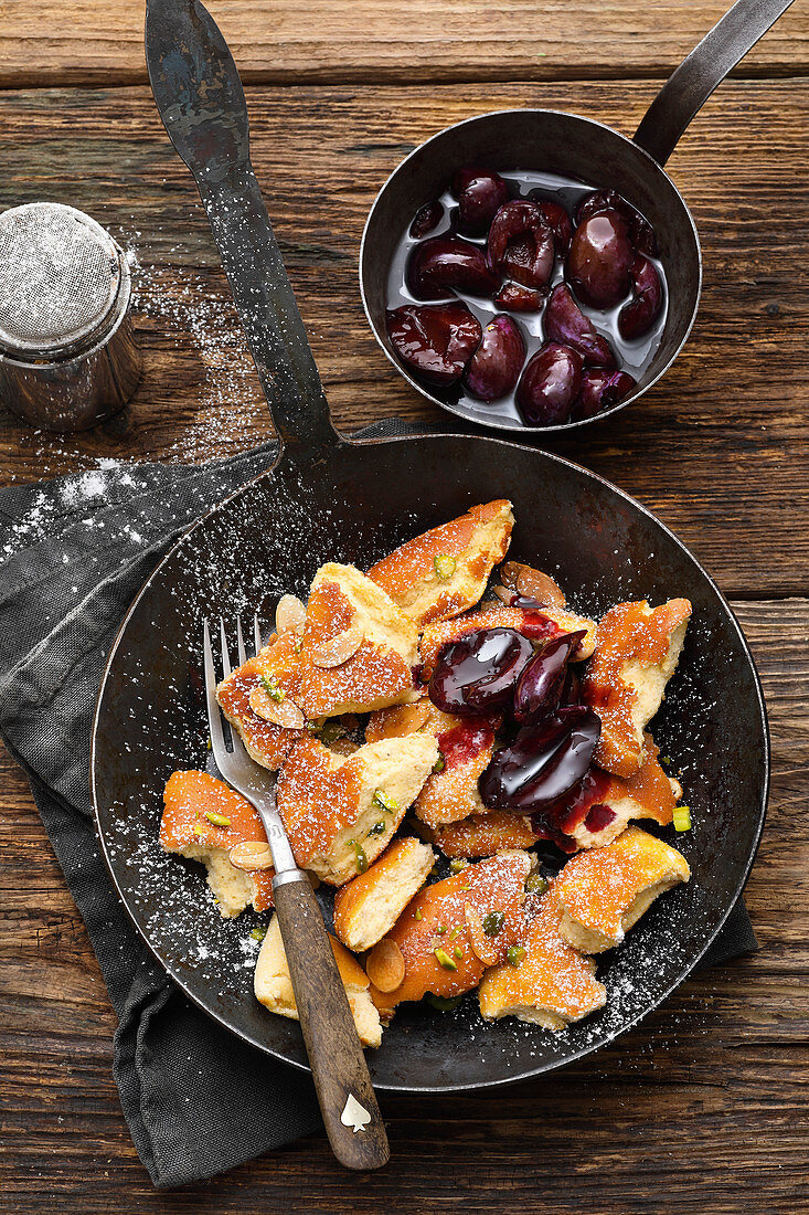 Shredded pancake with preserved damsons