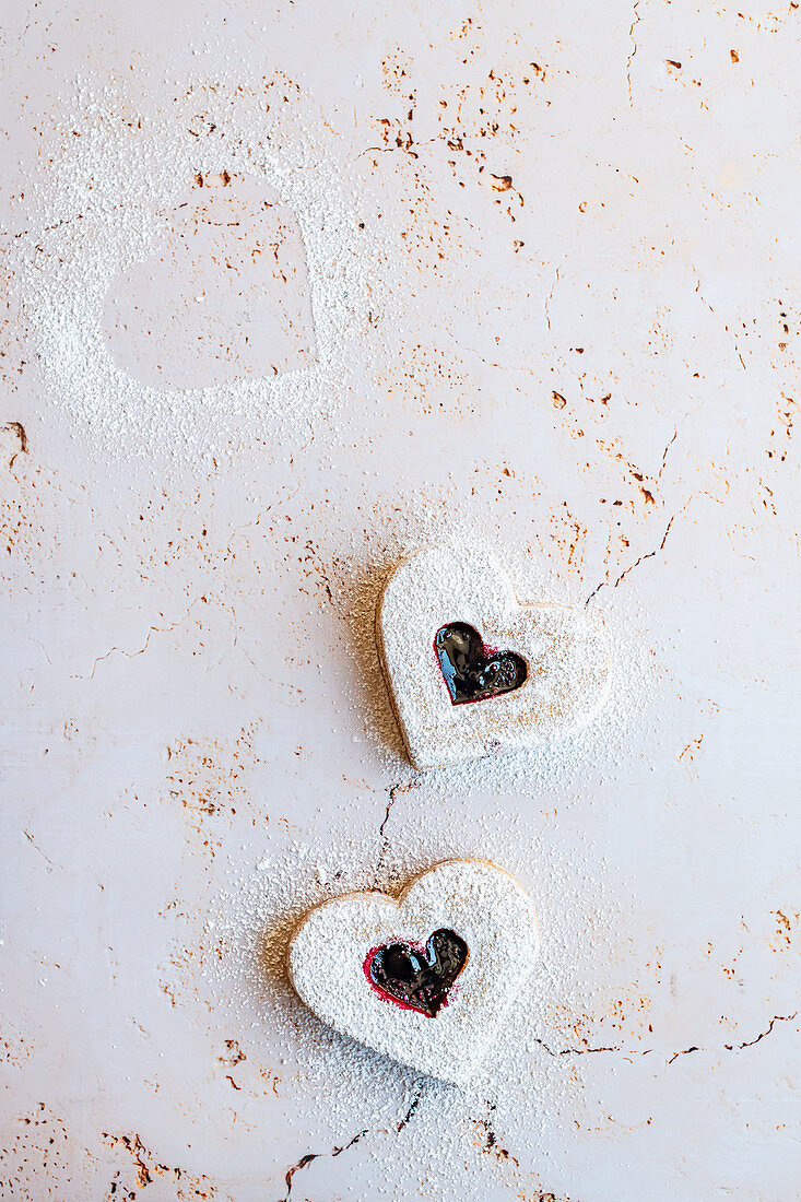 Heart shaped cookies with raspberry jam
