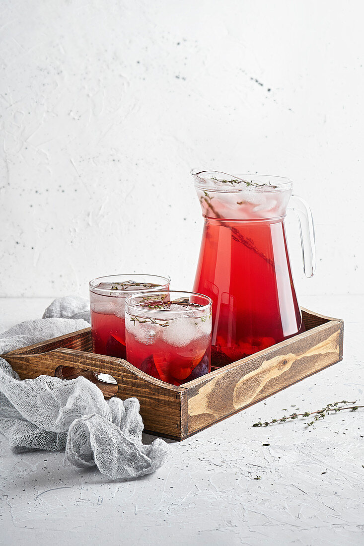 Plum lemonade with ice and thyme