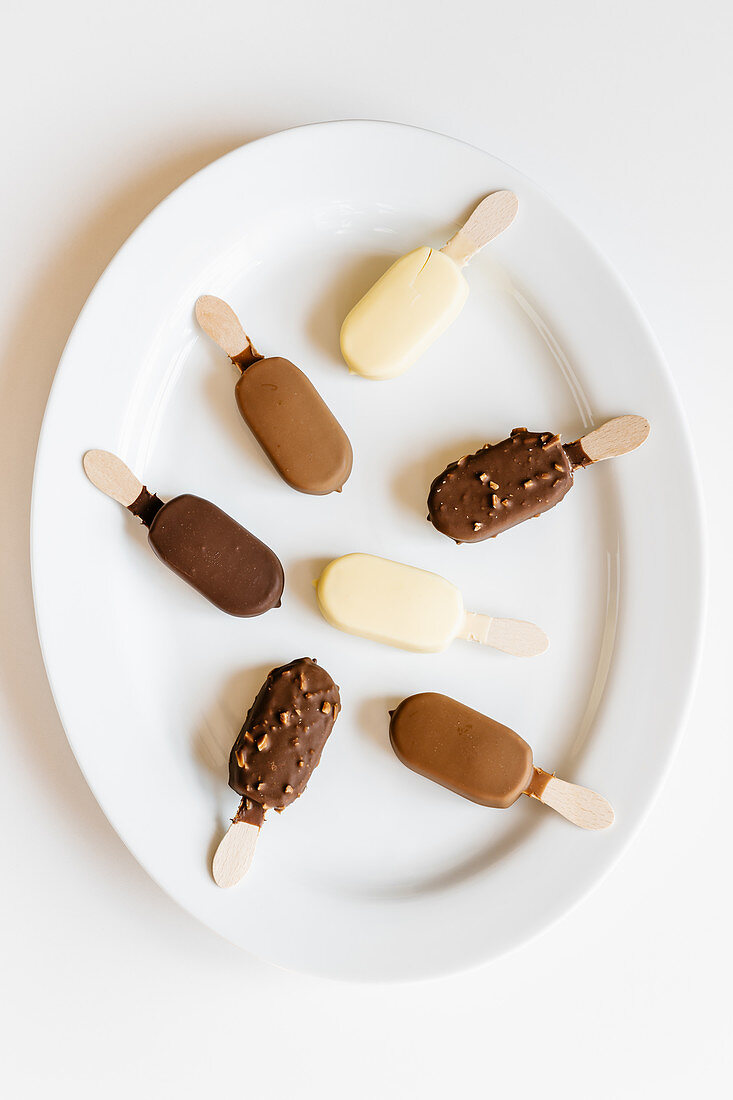 Assorted chocolate ice cream on sticks