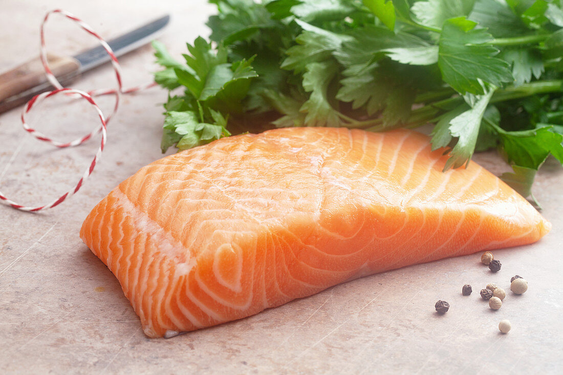 Raw salmon fillet with parsley