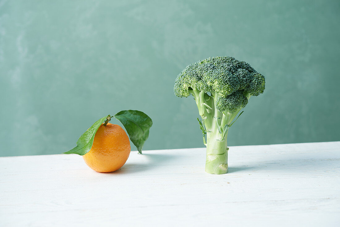 An orange and broccoli