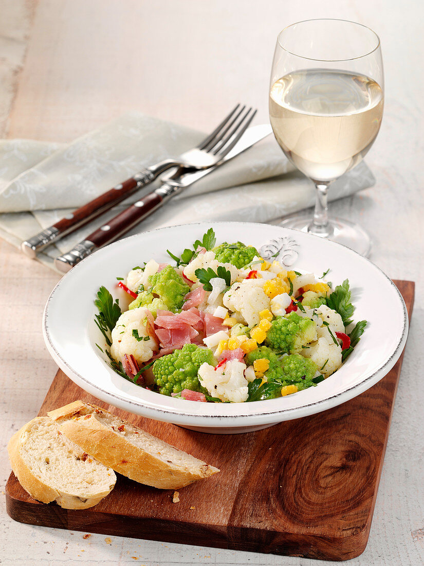 Cauliflower salad with hard-boiled eggs and ham