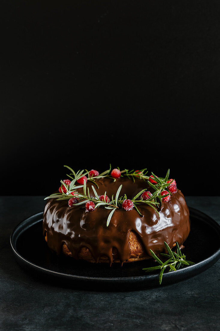 Chocolate cake with cranberries and rosemary for Christmas