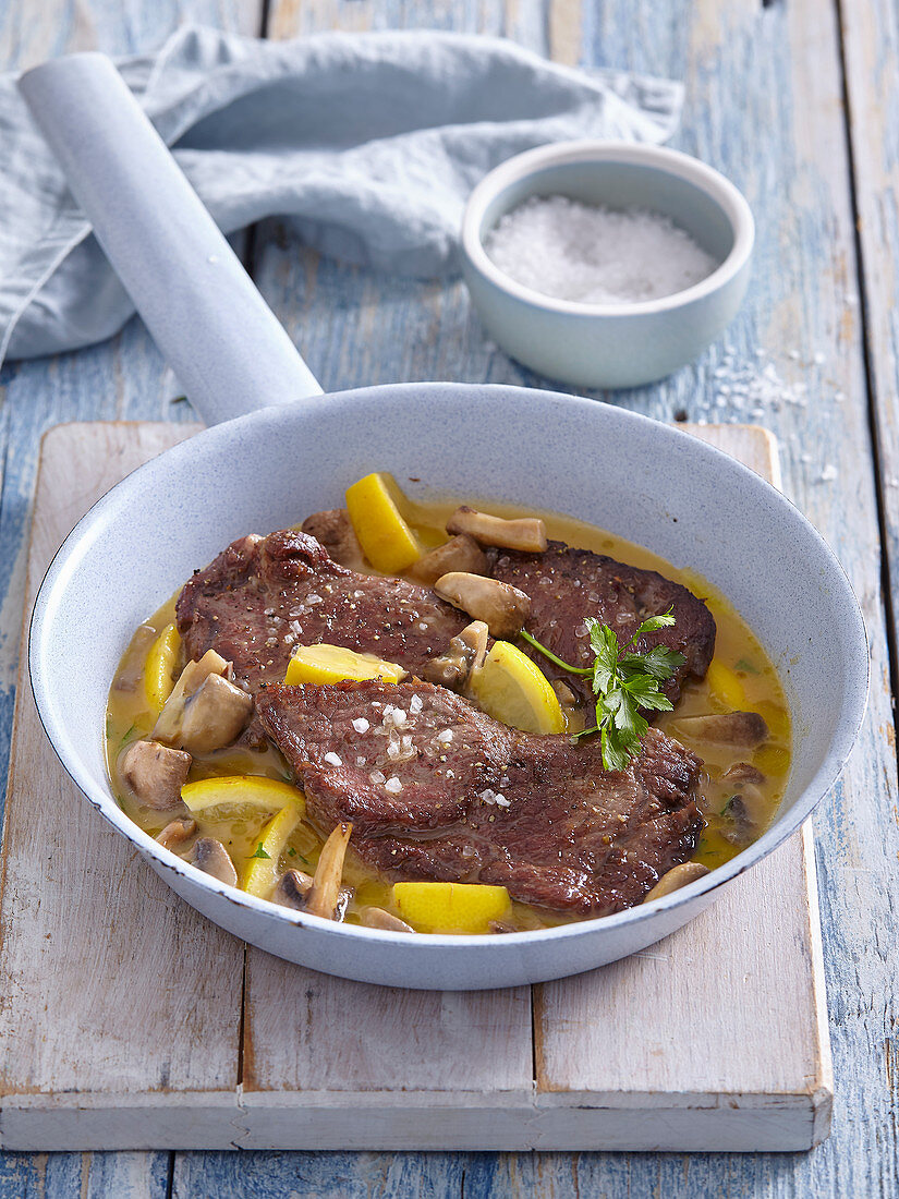 Beef with lemons and mushrooms