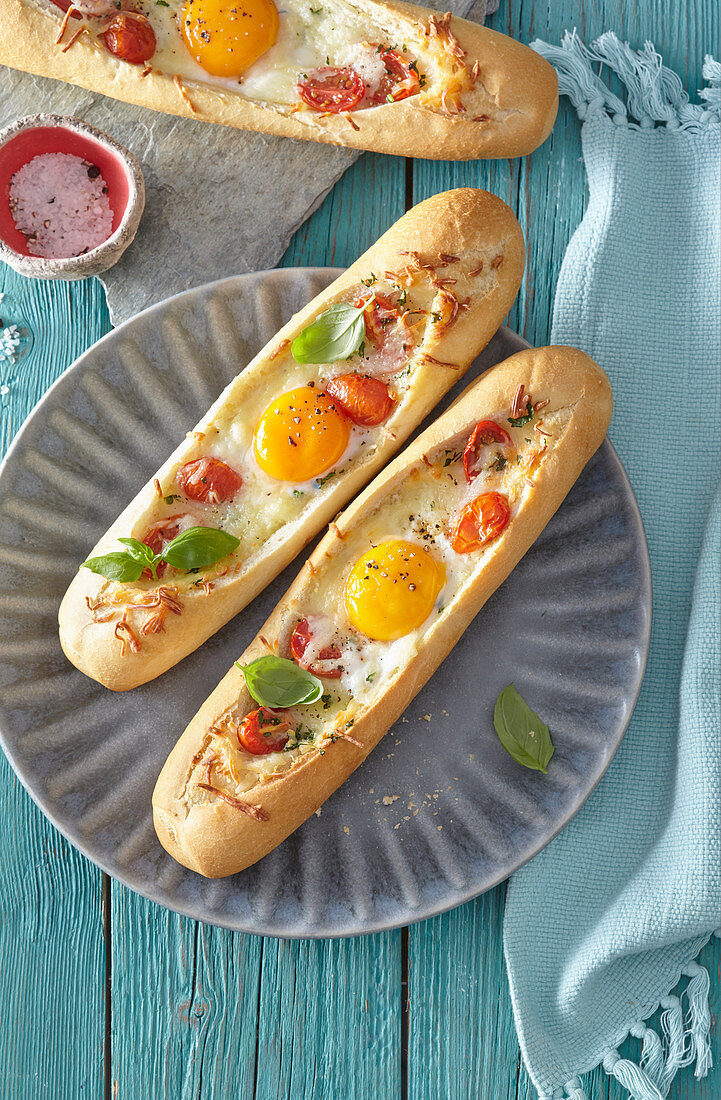 Boat shaped baguettes with tomatoes and eggs