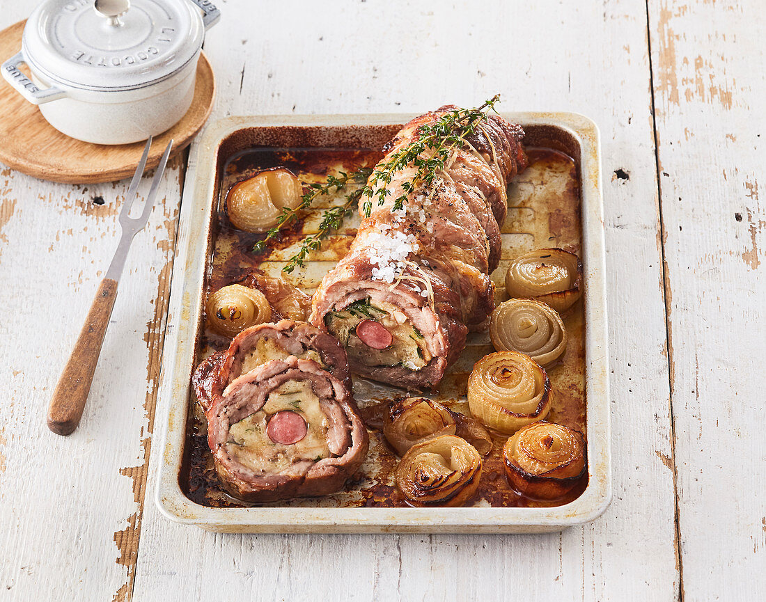 Pork roast with sausage filling and onions