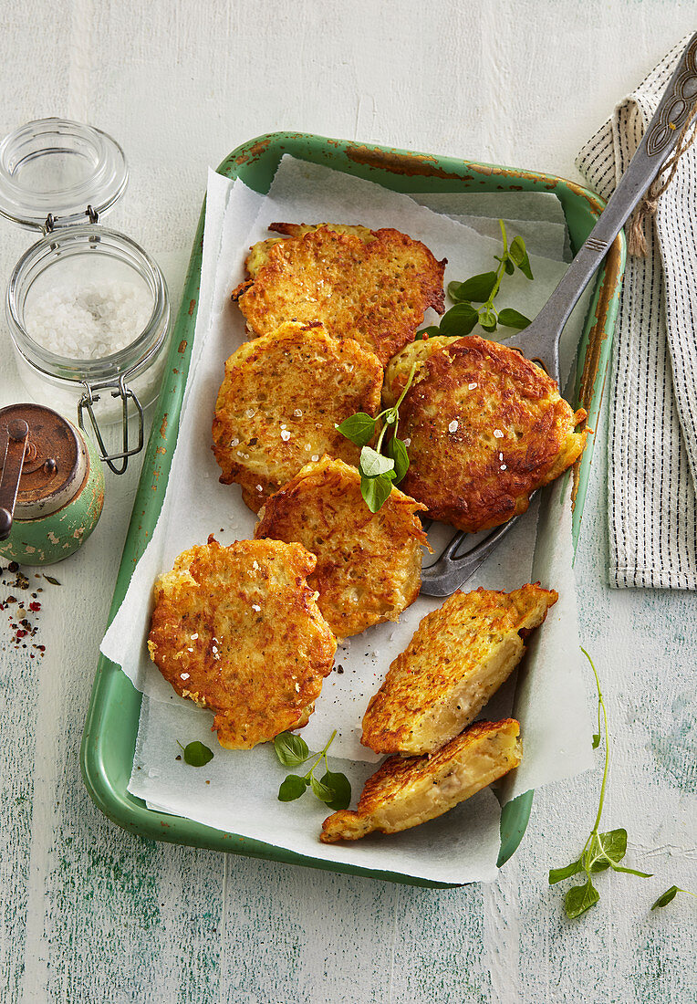 Crispy potato pancakes with smelly surface ripened round cheese