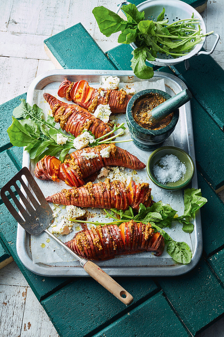 Roasted hasselback sweet potatoes with hempseed pesto