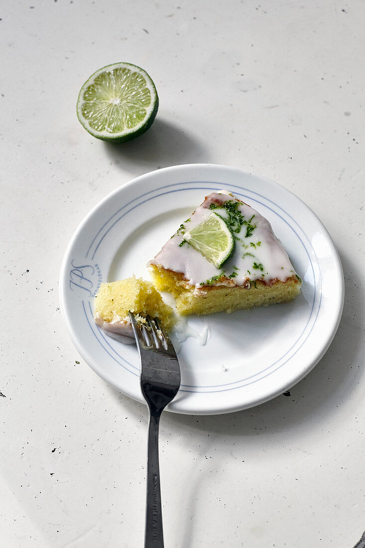 A piece of lime cake with a fork