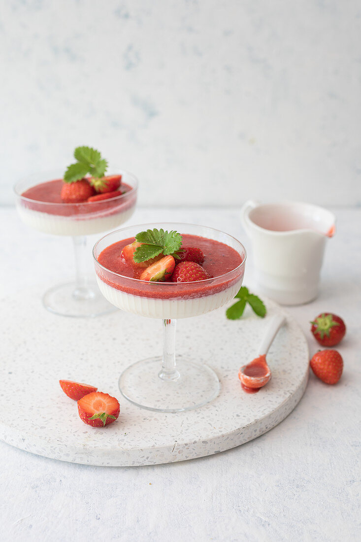 Panna cotta with strawberries and coulis