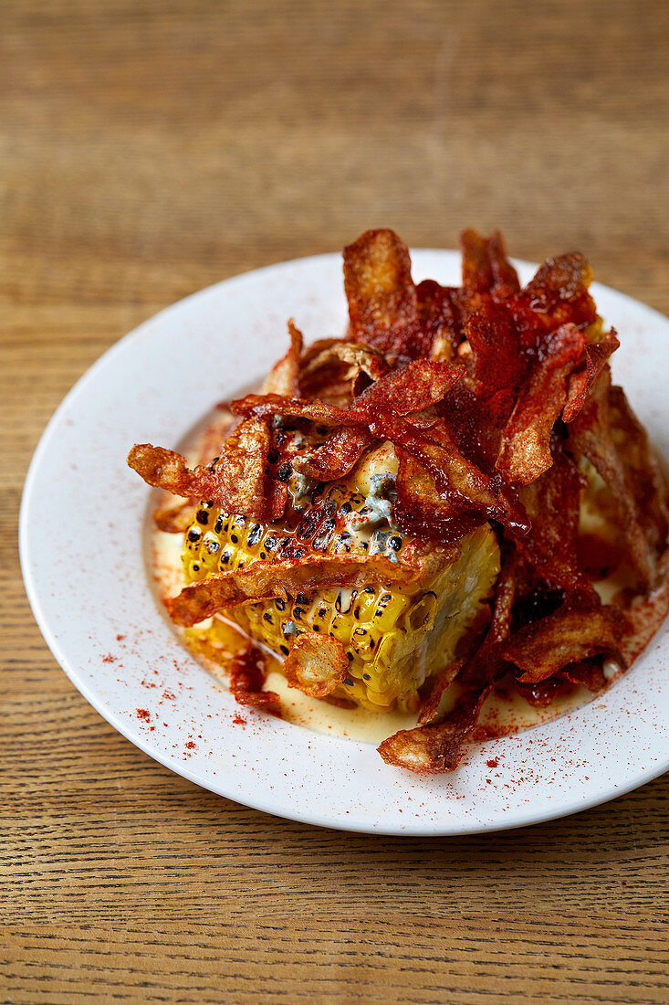 Corn on the cob, stilton fonduta and crispy potato skins