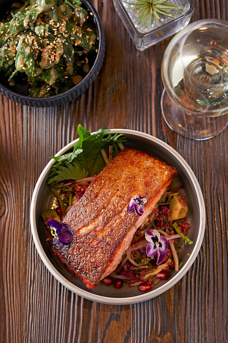 Trout teriyaki with pink quinoa, fennel, pomegranate and cucumber