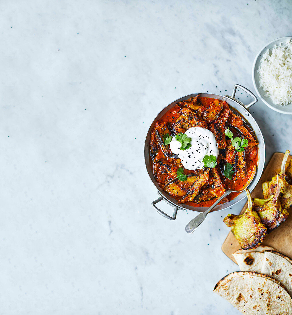 Aubergine curry with lamb cutlets