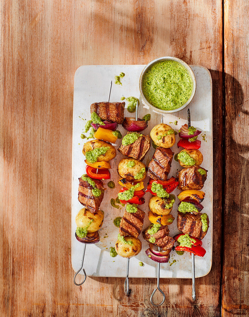 Smoky steak and potato skewers with chimichurri sauce